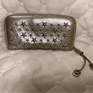Jimmy Choo stars wallet in metallic silver and silver stars.